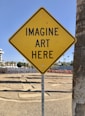 a yellow sign that says imagine art here