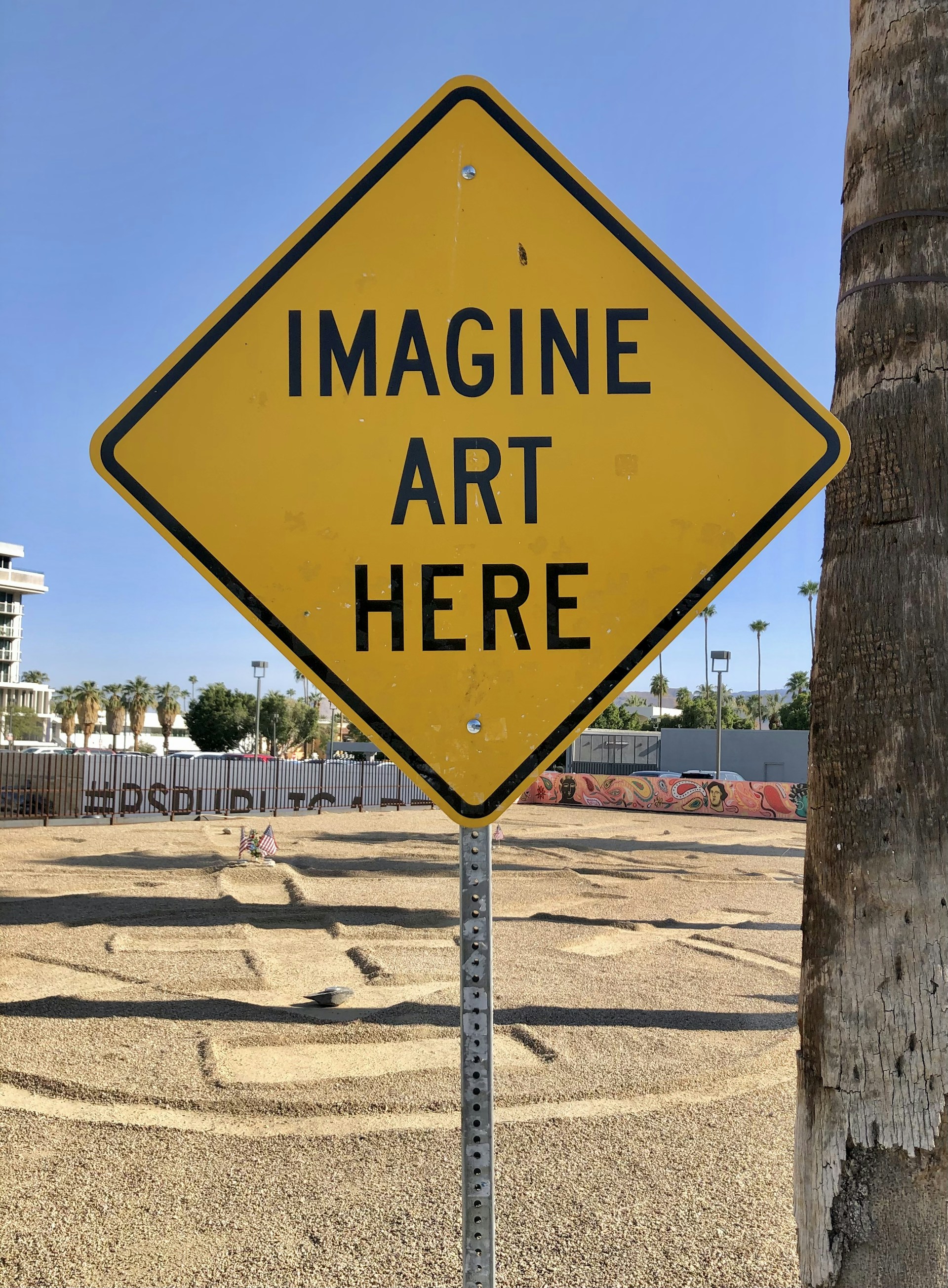 a yellow sign that says imagine art here