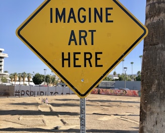 a yellow sign that says imagine art here