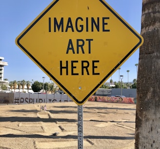 a yellow sign that says imagine art here