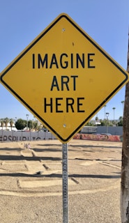 a yellow sign that says imagine art here