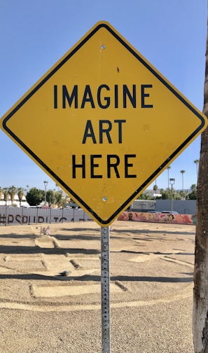 a yellow sign that says imagine art here