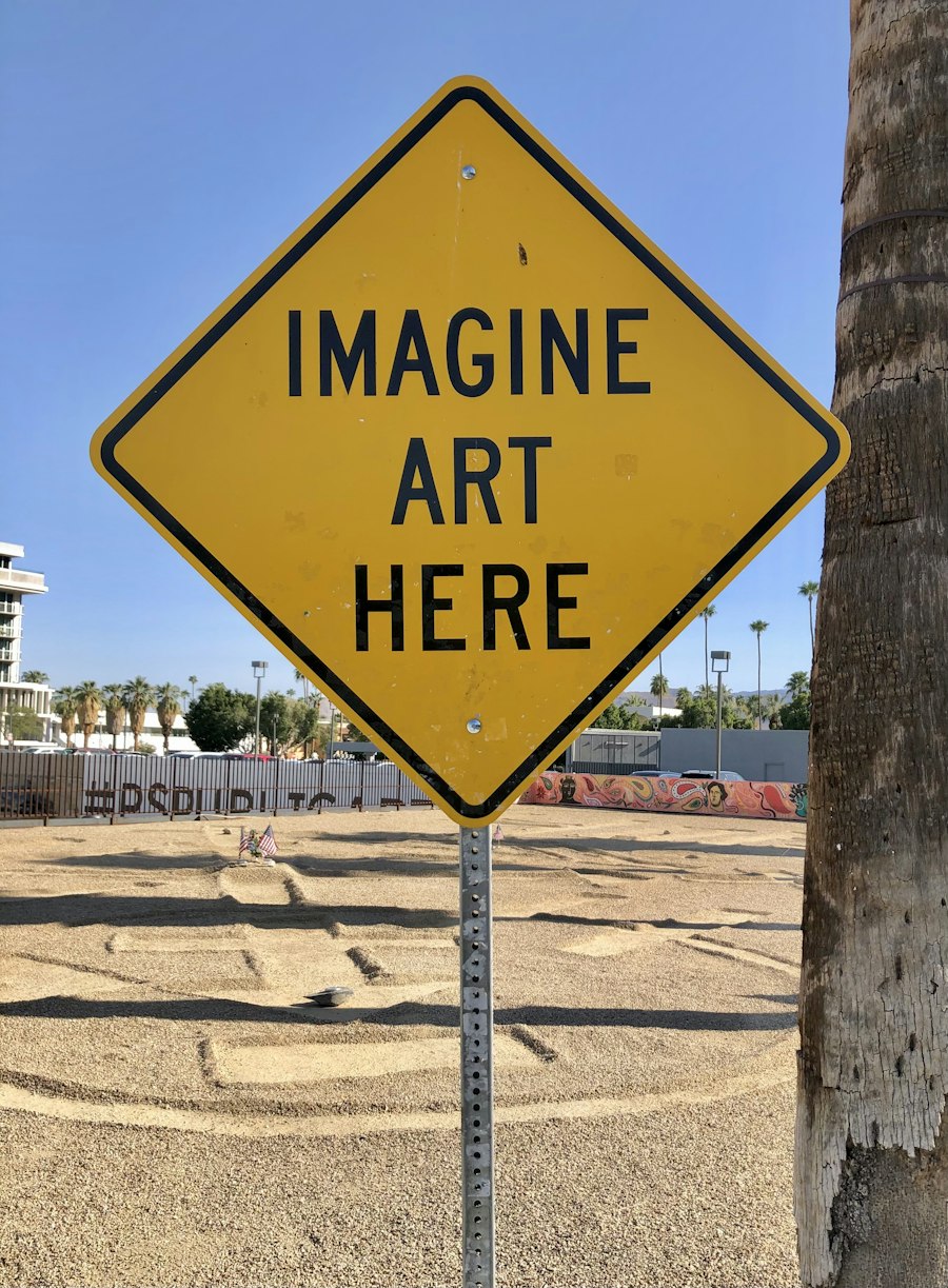 Yellow road sign reading imagine art here