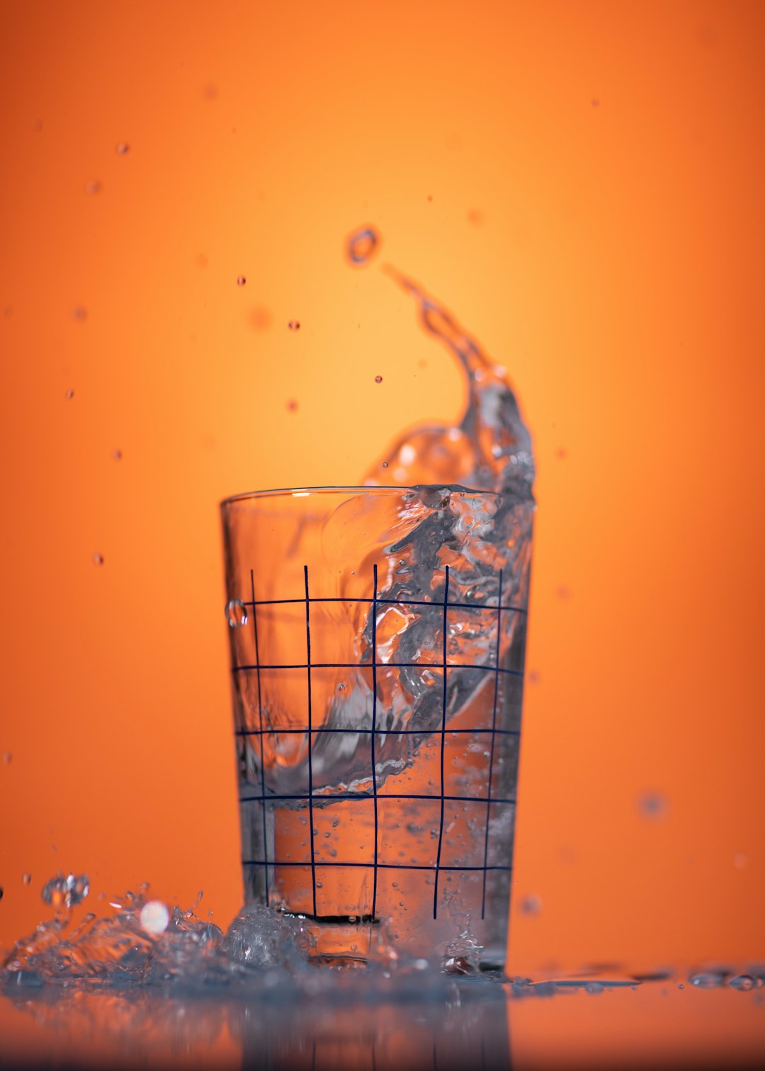 water pouring on clear drinking glass