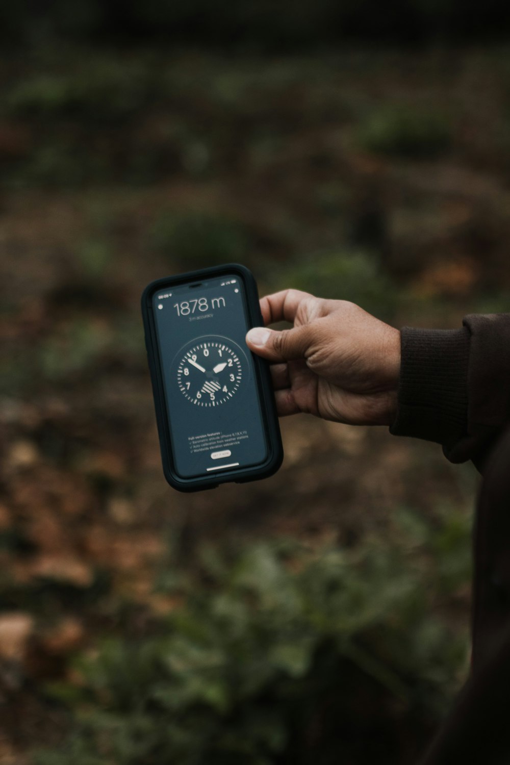 person holding black digital device