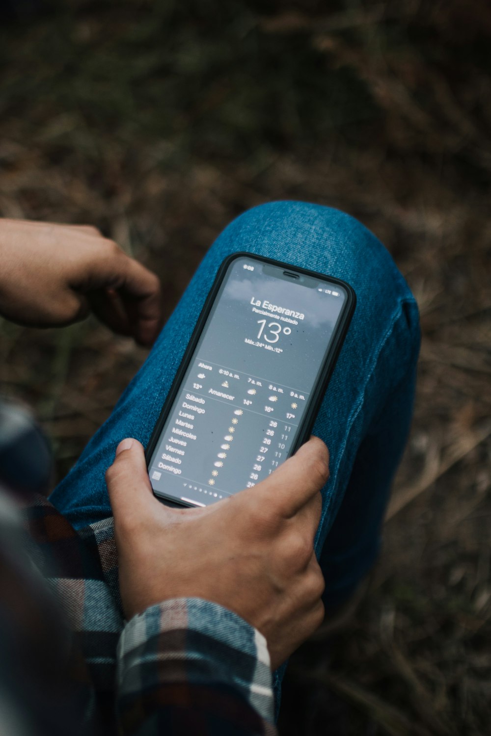 person holding black android smartphone