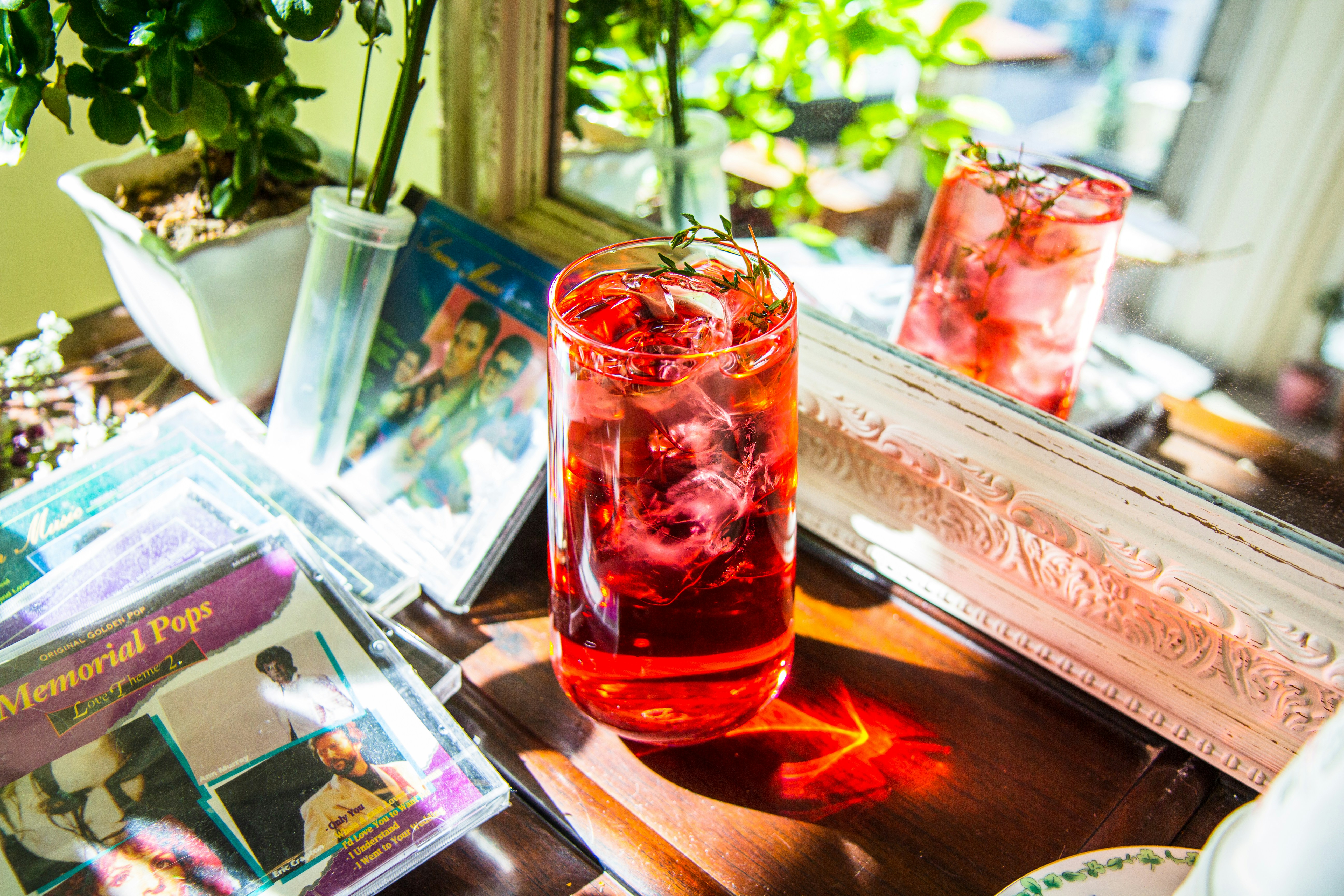 clear drinking glass with red liquid inside