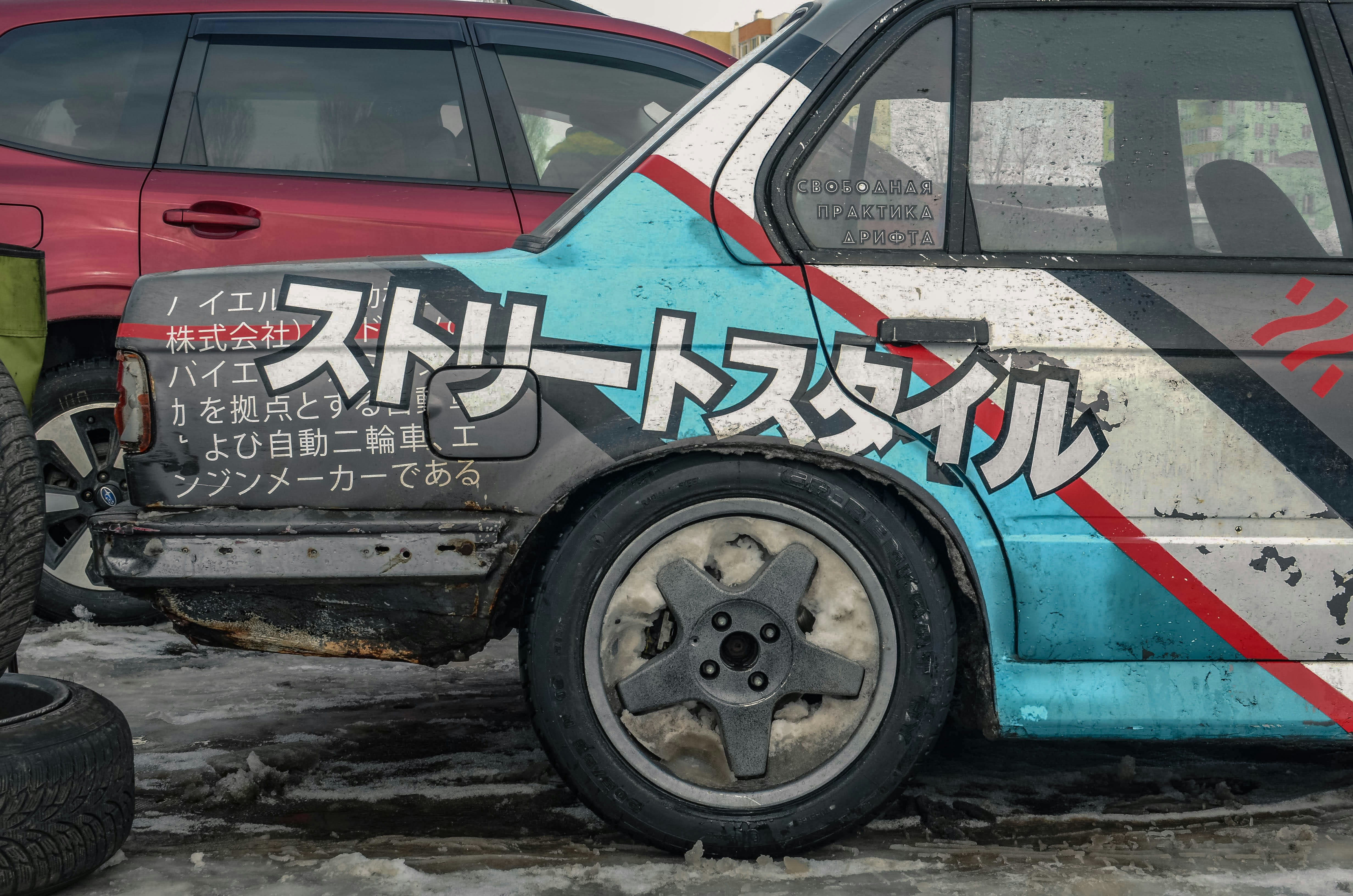 BMW E30 on local drift gig near Kyiv. Some Japanese symbols as classic driiftcar attribute. Owner of this car on Instagram: @dima.stilin