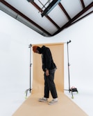 A minimalist streetwear look captured in studio lighting.