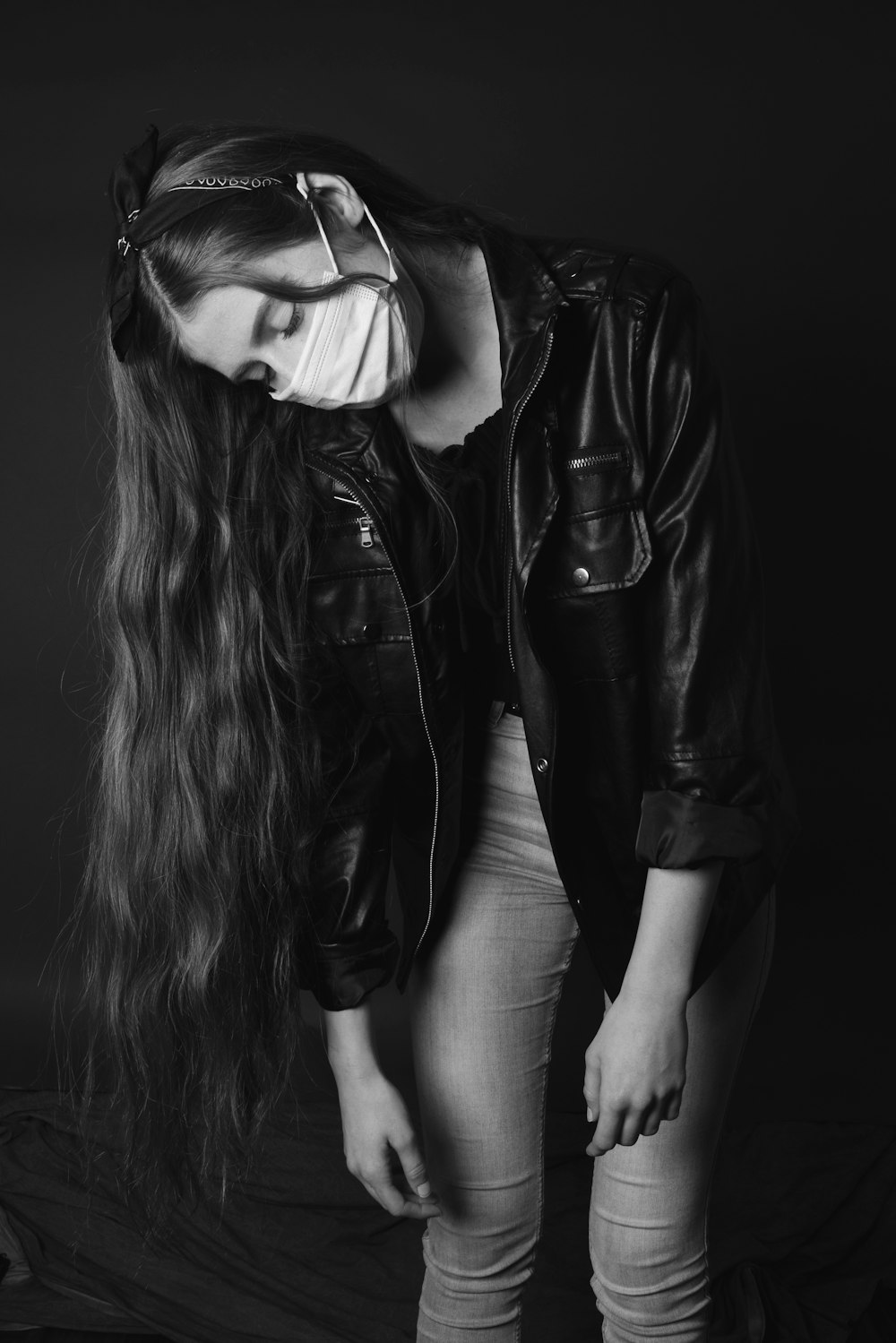 woman in black leather jacket wearing black sunglasses