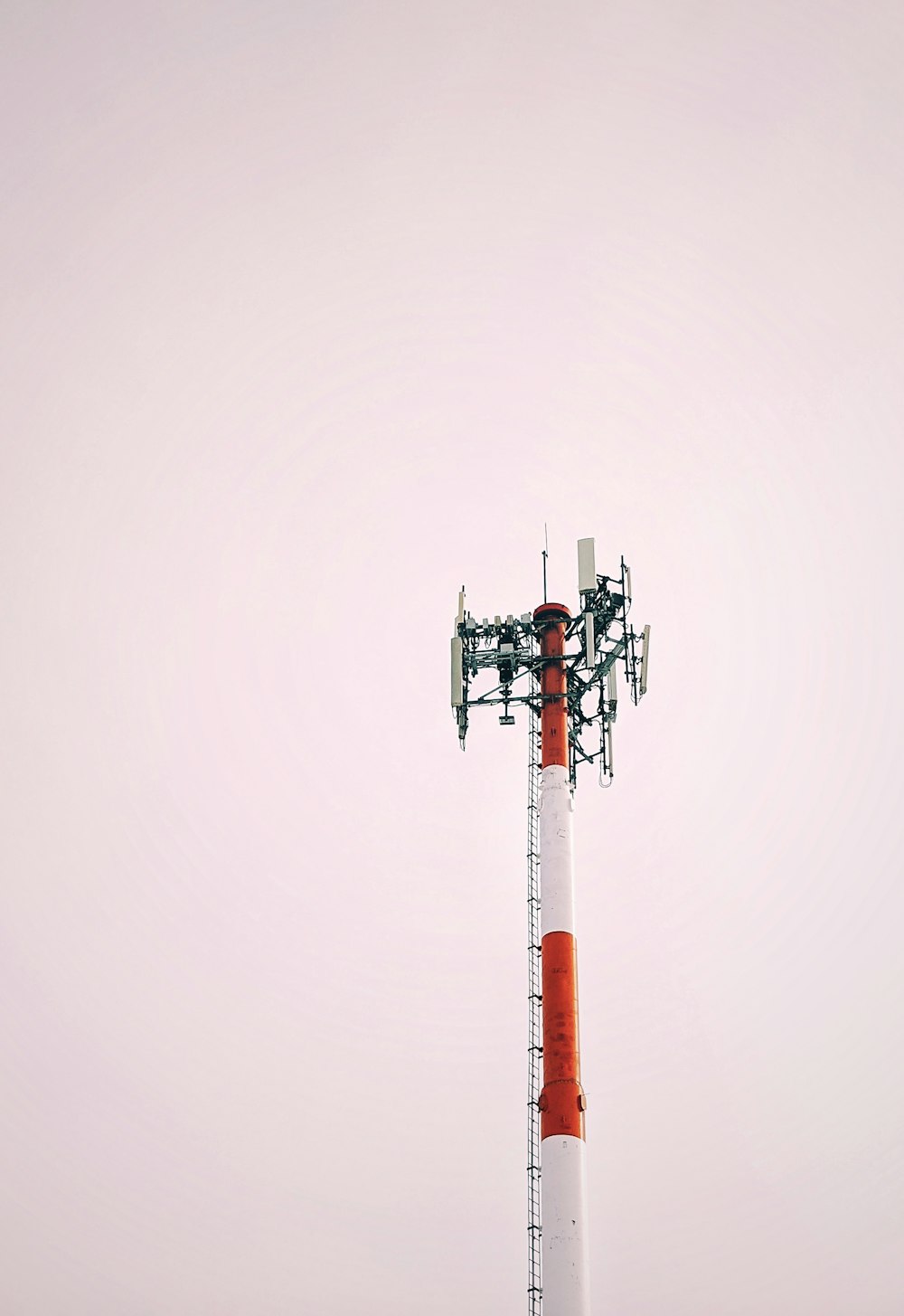 red and white tower under white sky