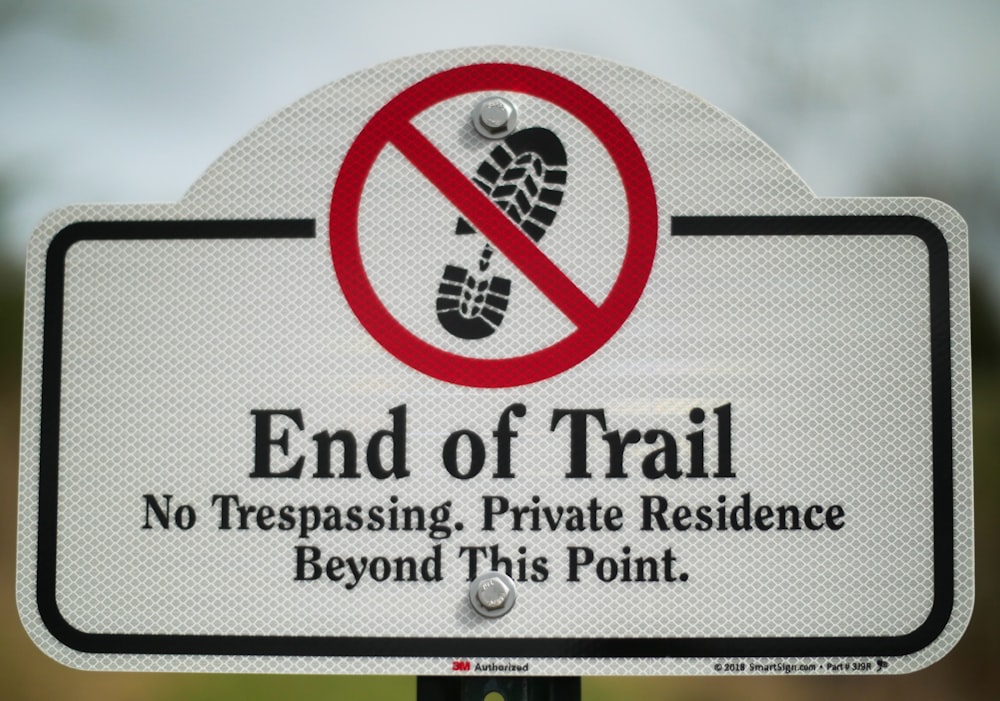 a sign with a picture of a person's foot in it