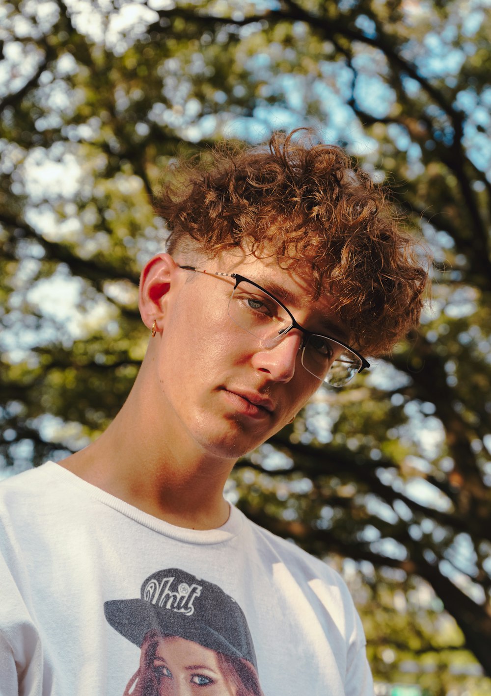 man in white crew neck shirt wearing eyeglasses