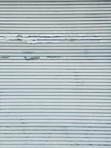 white and black striped textile