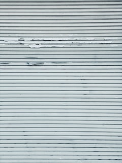 Industrial metal surface being treated with protective coating.