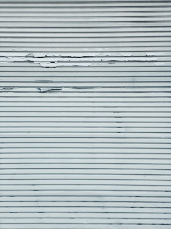 Industrial metal surface being treated with protective coating.