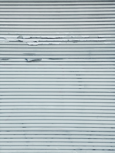 white and black striped textile
