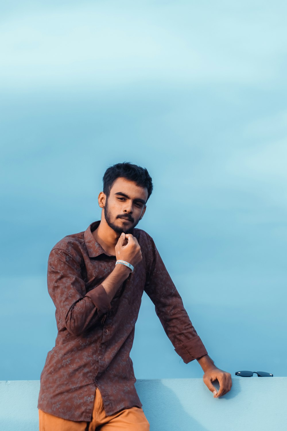 man in brown long sleeve shirt