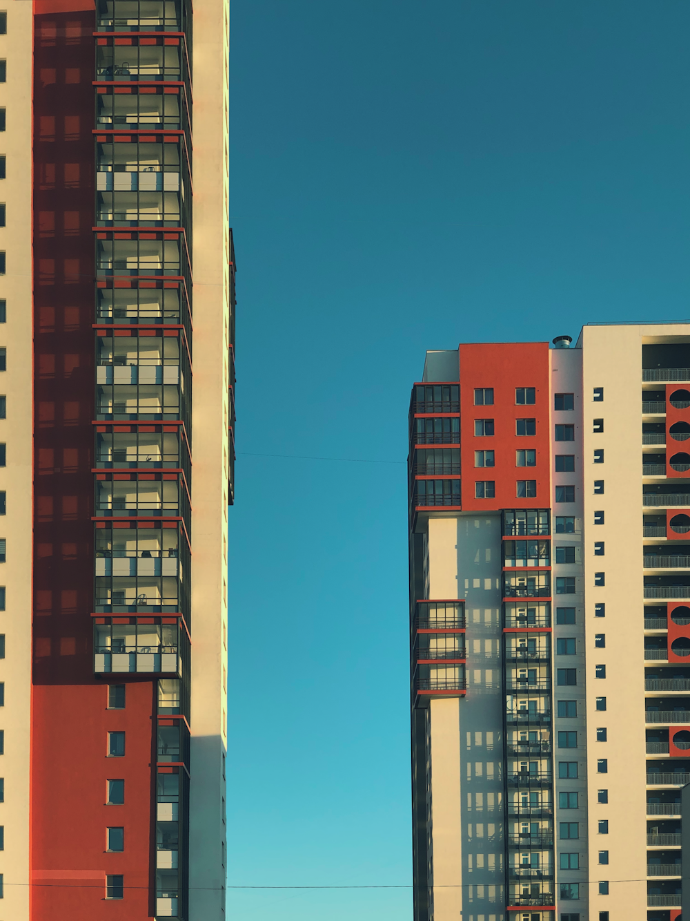 red and white concrete building under blue sky during daytime