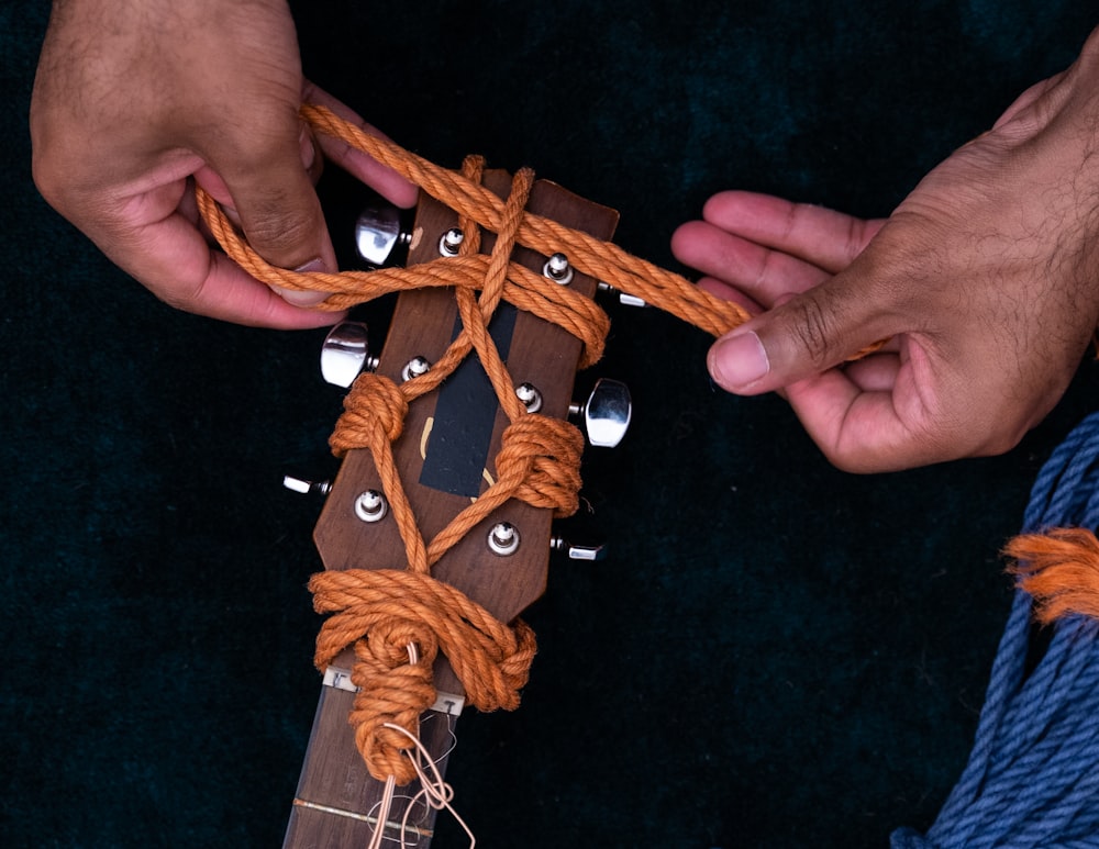 brown wooden cross on black textile