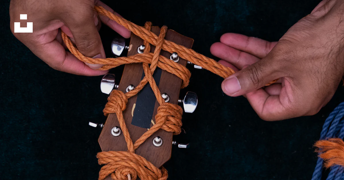 Brown Rope Cross Pattern Brown wooden cross on black textile photo – Free Guitar Image on Unsplash