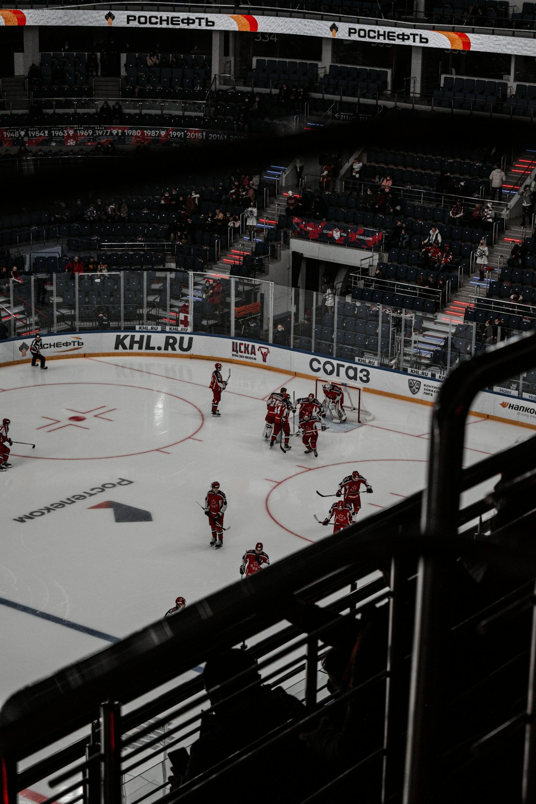 people playing ice hockey on ice stadium