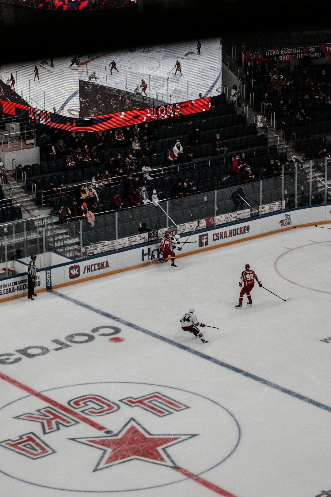 people playing ice hockey on stadium