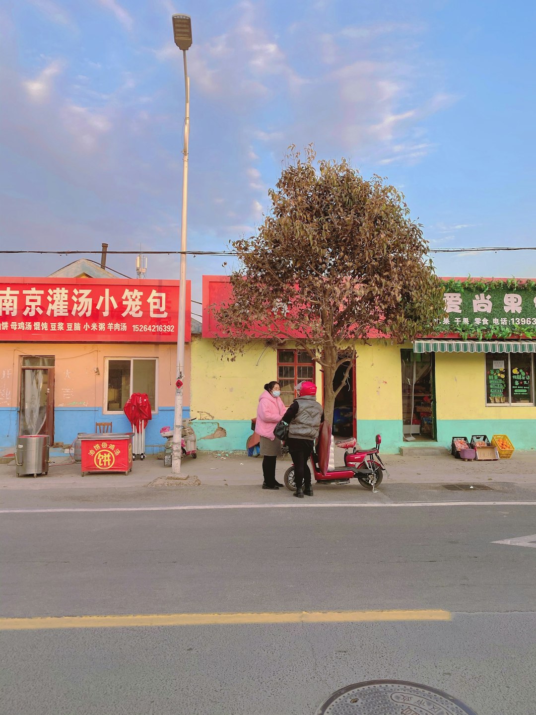 man in black jacket riding on red motorcycle during daytime