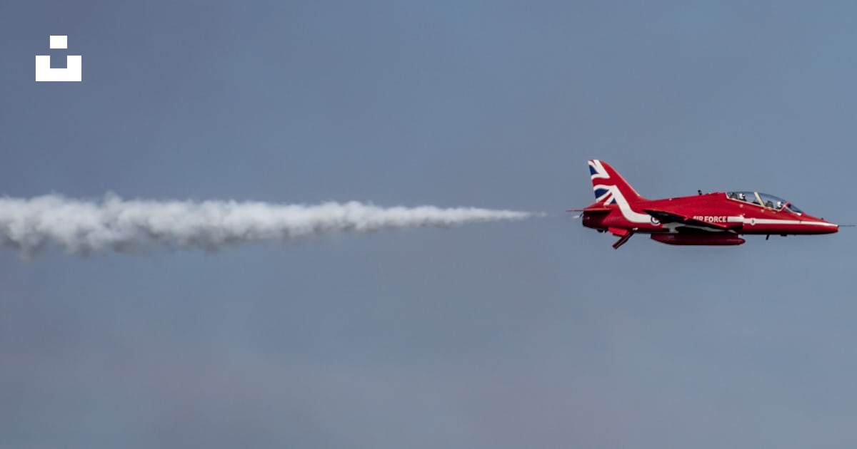 Red jet plane in mid air photo – Free Uk Image on Unsplash