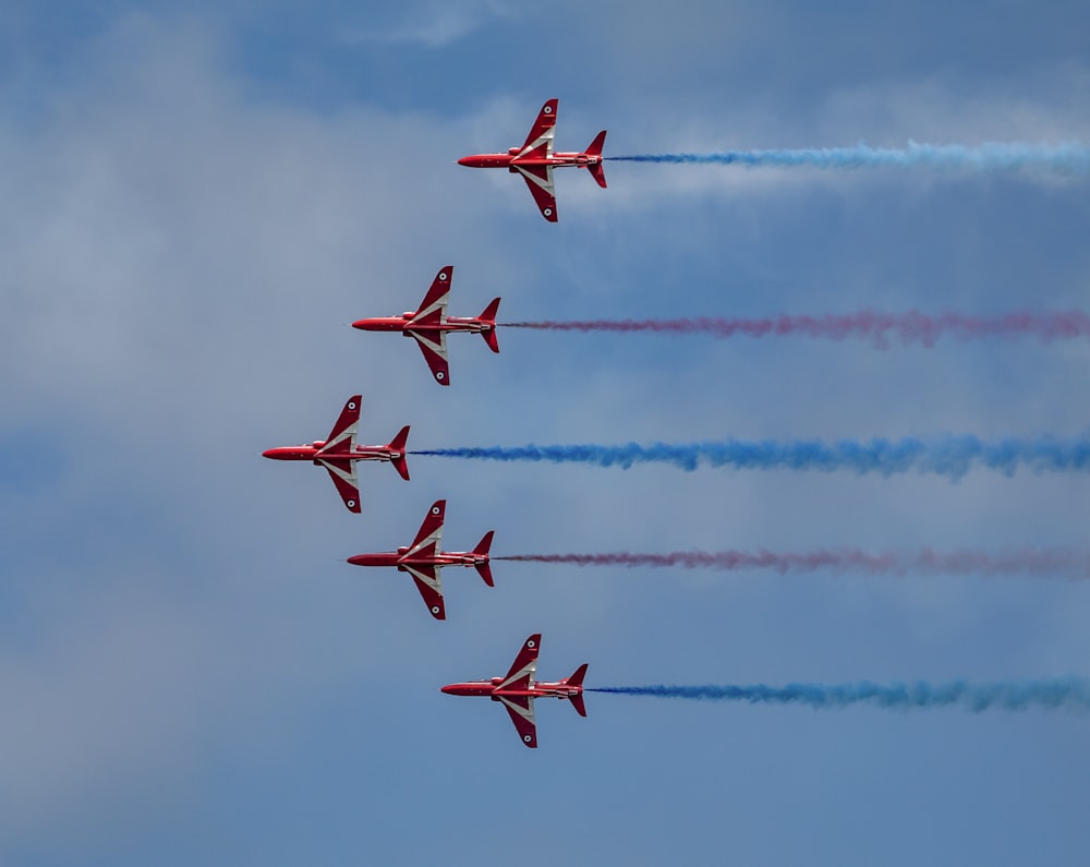 red jet planes in sky