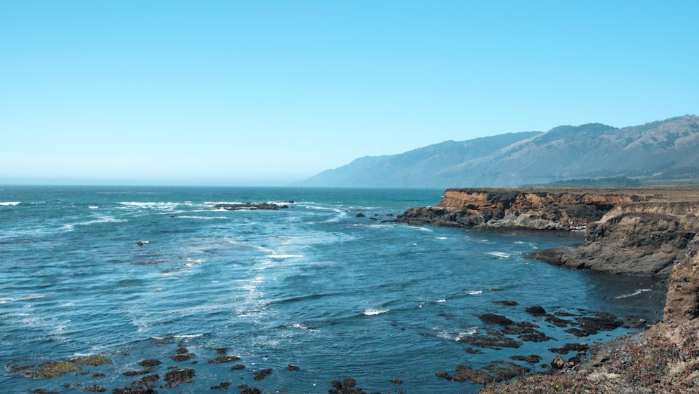 blue sea under blue sky during daytime