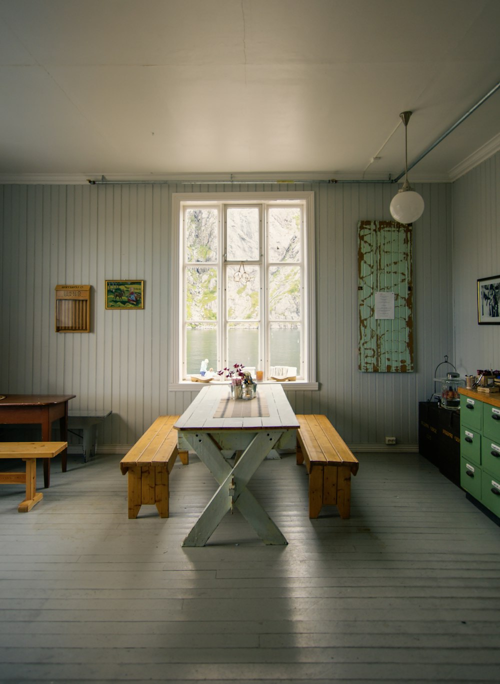 brown wooden table near window