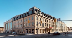 beige and brown concrete building under blue sky during daytime