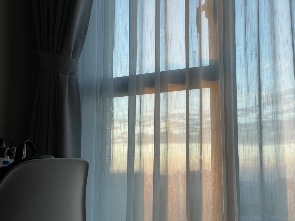white window curtain during daytime