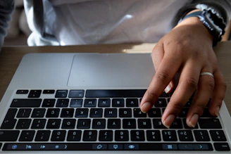 User wearing the Zeneio ring, fingers poised over a futuristic digital interface.