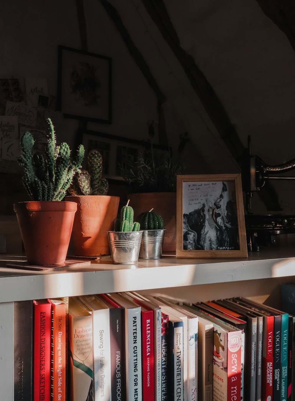 books on white wooden shelf