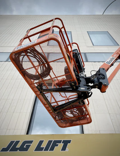 Scissor lift raised on a work site