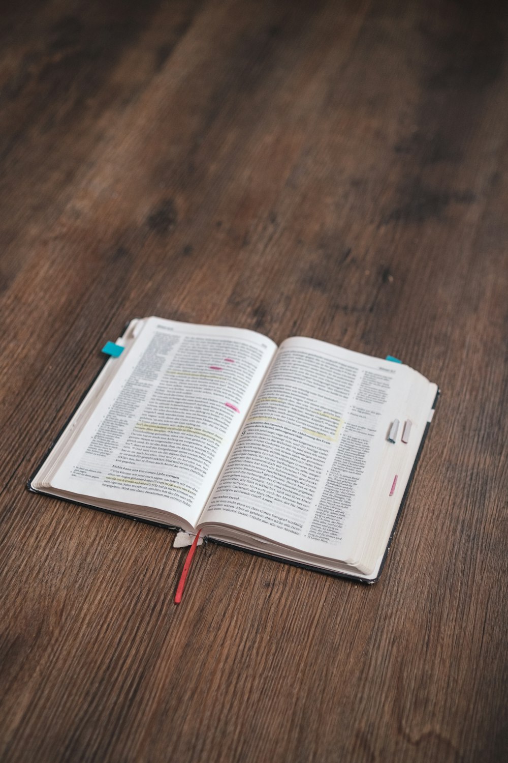 white book page on brown wooden table