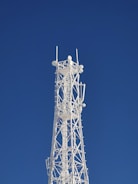 gray metal tower under blue sky