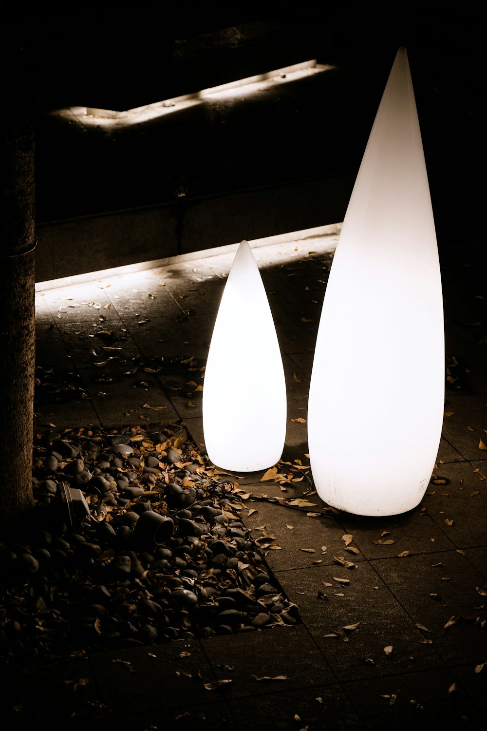 white light bulb on brown wooden post