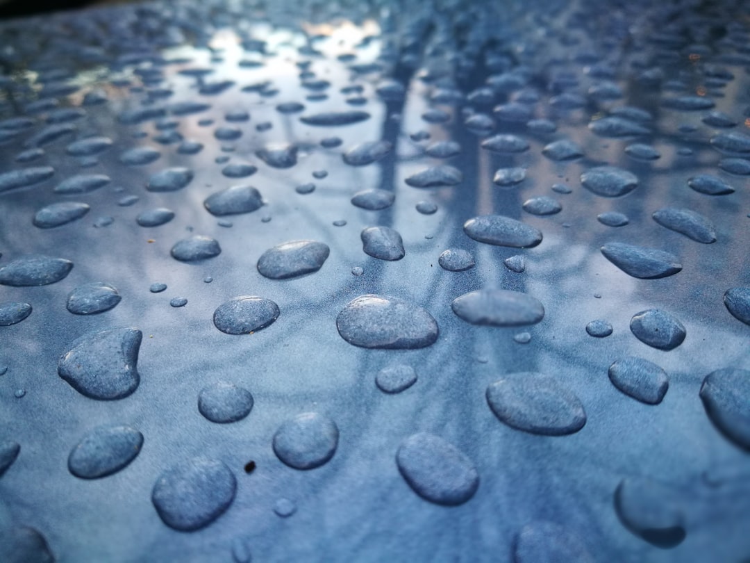 water droplets on blue surface