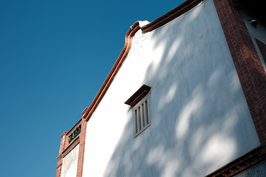 white and brown concrete building under blue sky during daytime