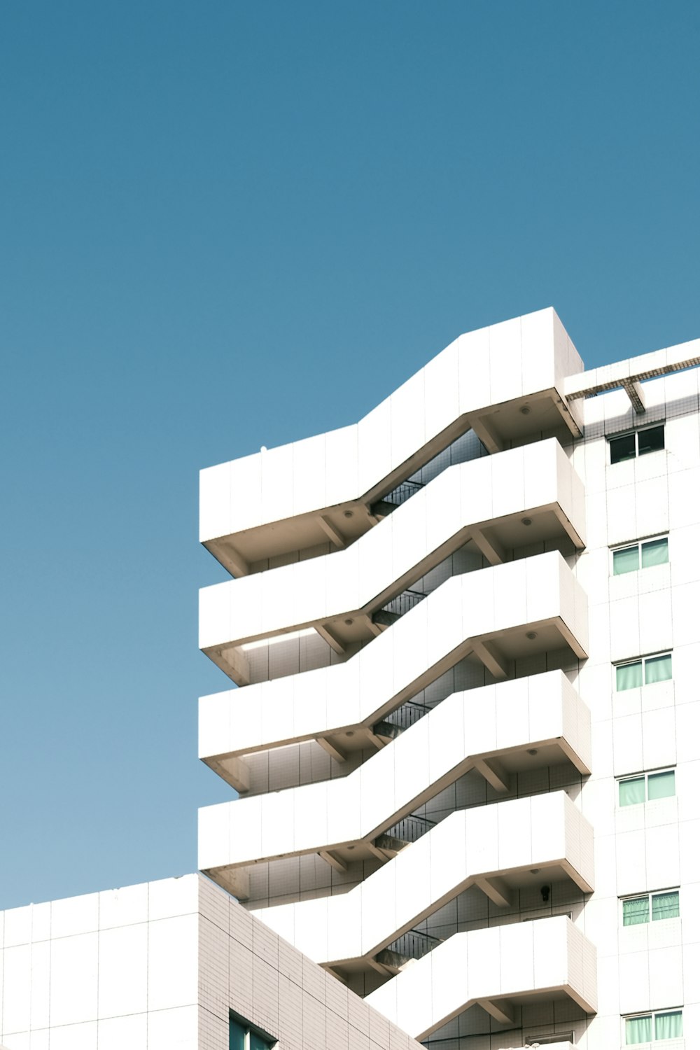 white concrete building under blue sky during daytime