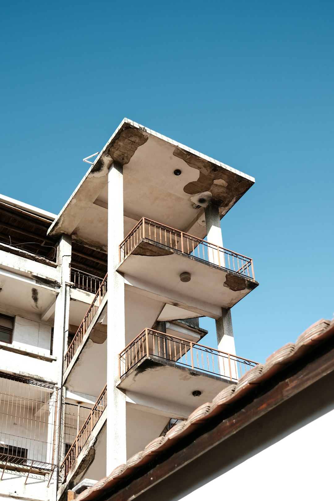 white concrete building under blue sky during daytime