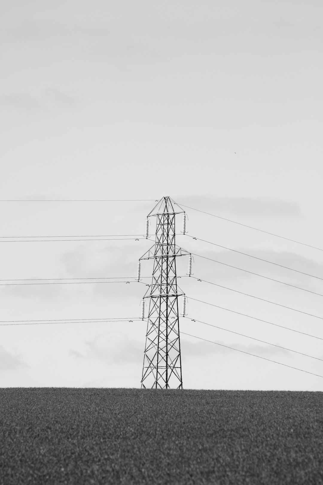 black electric tower under white sky