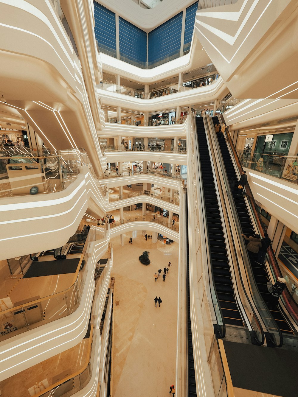 people walking on hallway inside building