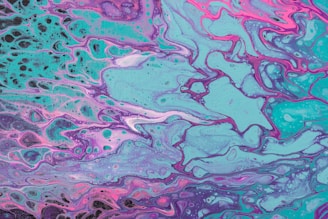 Abstract turquoise and purple painting on canvas.