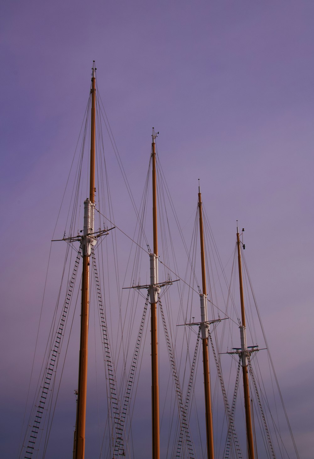 brown and white sail boat on sea during daytime