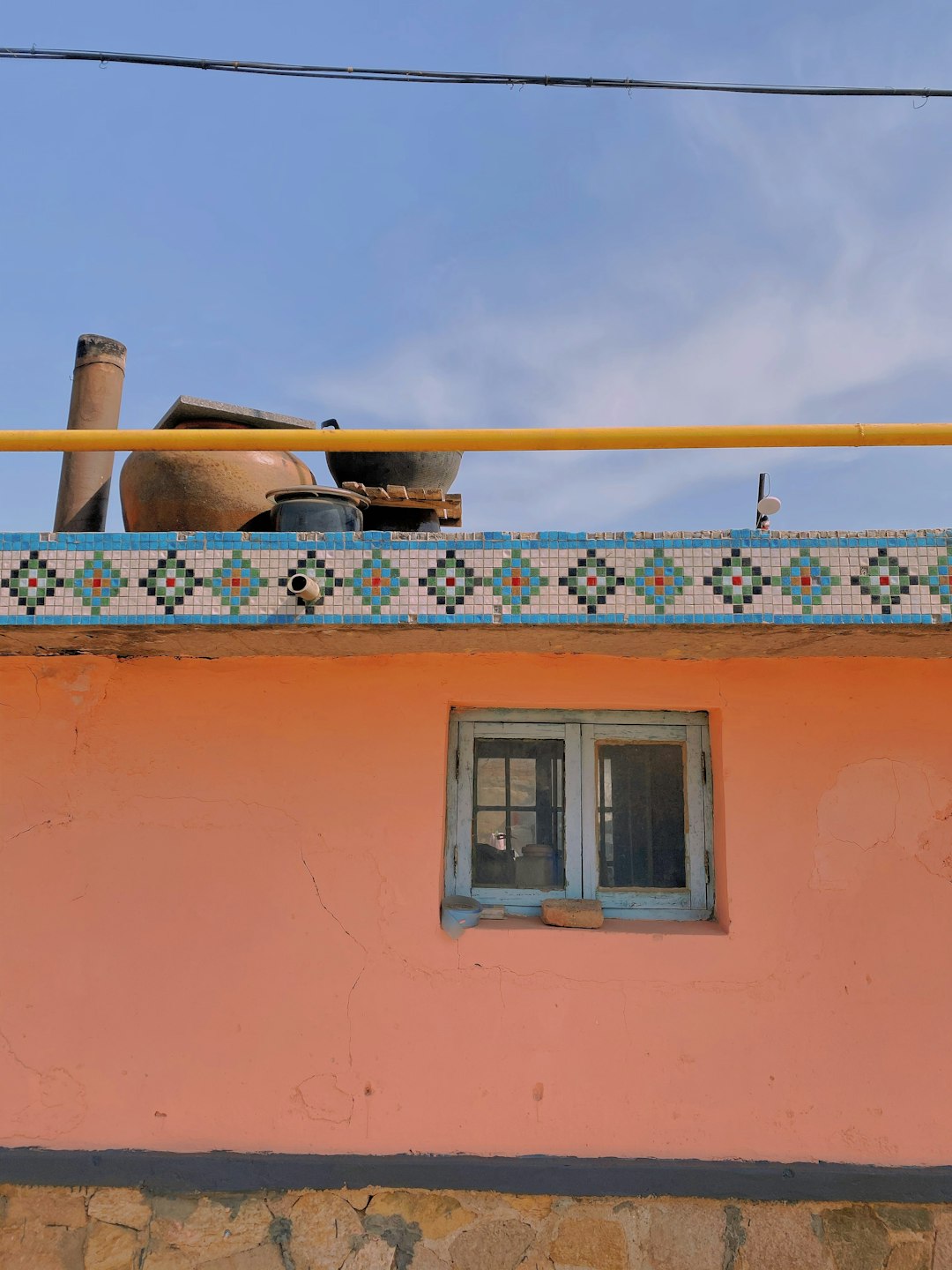 white wooden window frame on orange concrete wall