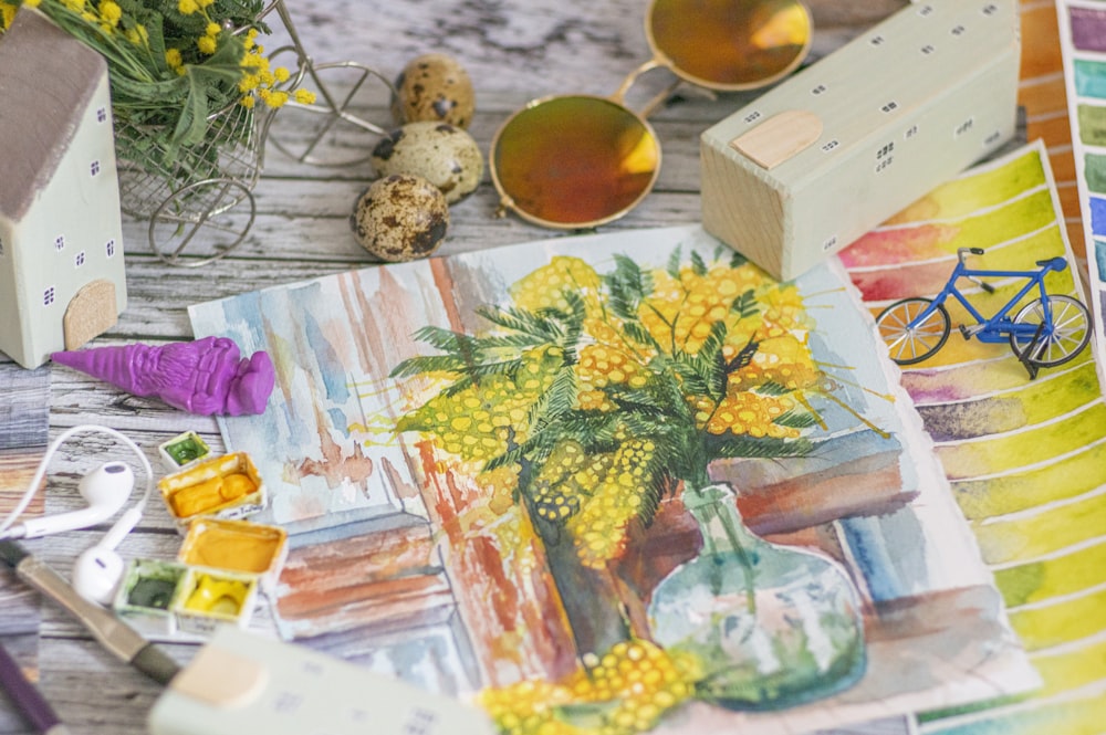 yellow flowers in clear glass vase